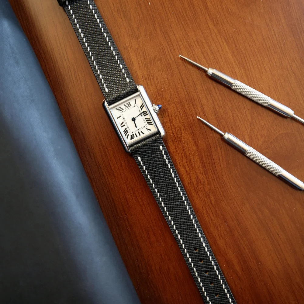 Official Epoch Straps image of a black Saffiano leather strap fitted to a Cartier Tank.