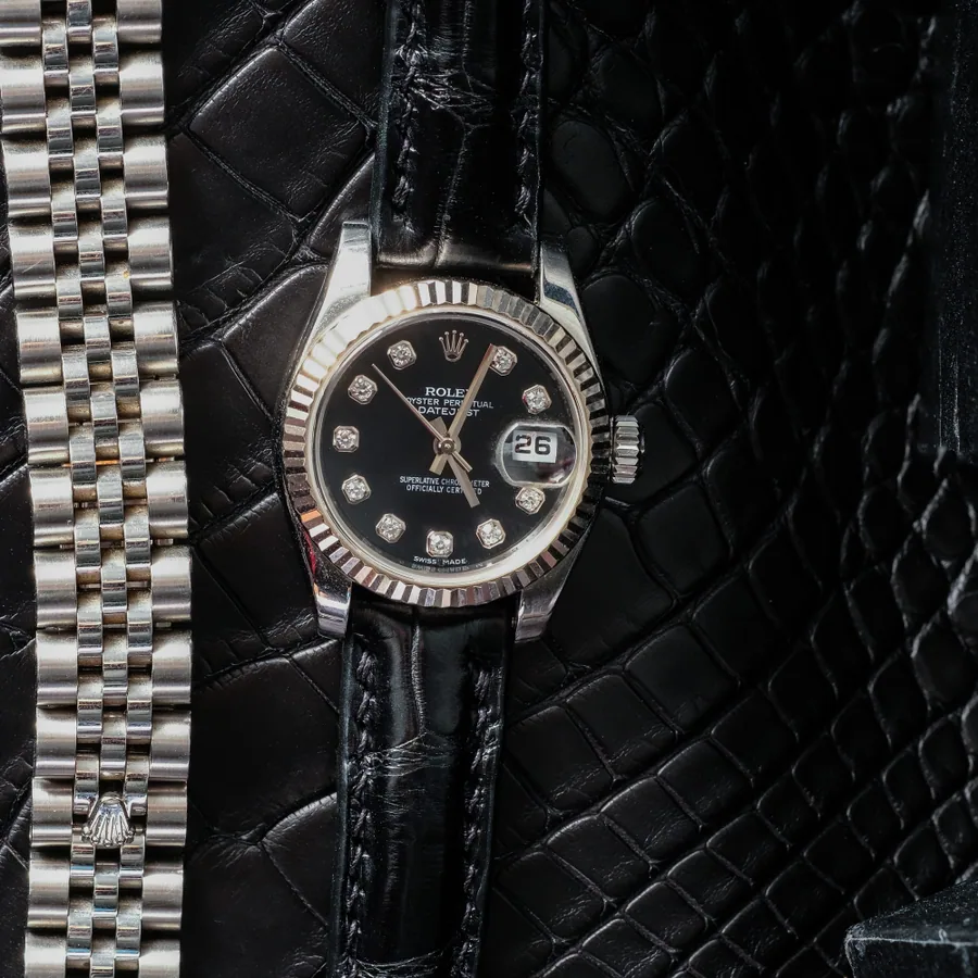 Official Epoch Straps product photo showing a black alligator leather strap fitted to a Datejust beside a steel bracelet.