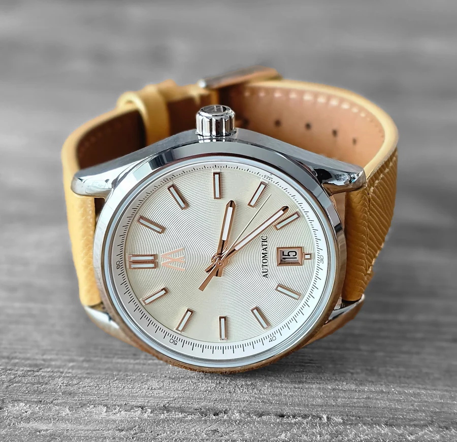 Official Meshberg image of the 37 Automatic Champagne Mist with a champagne dial on a tan leather strap.